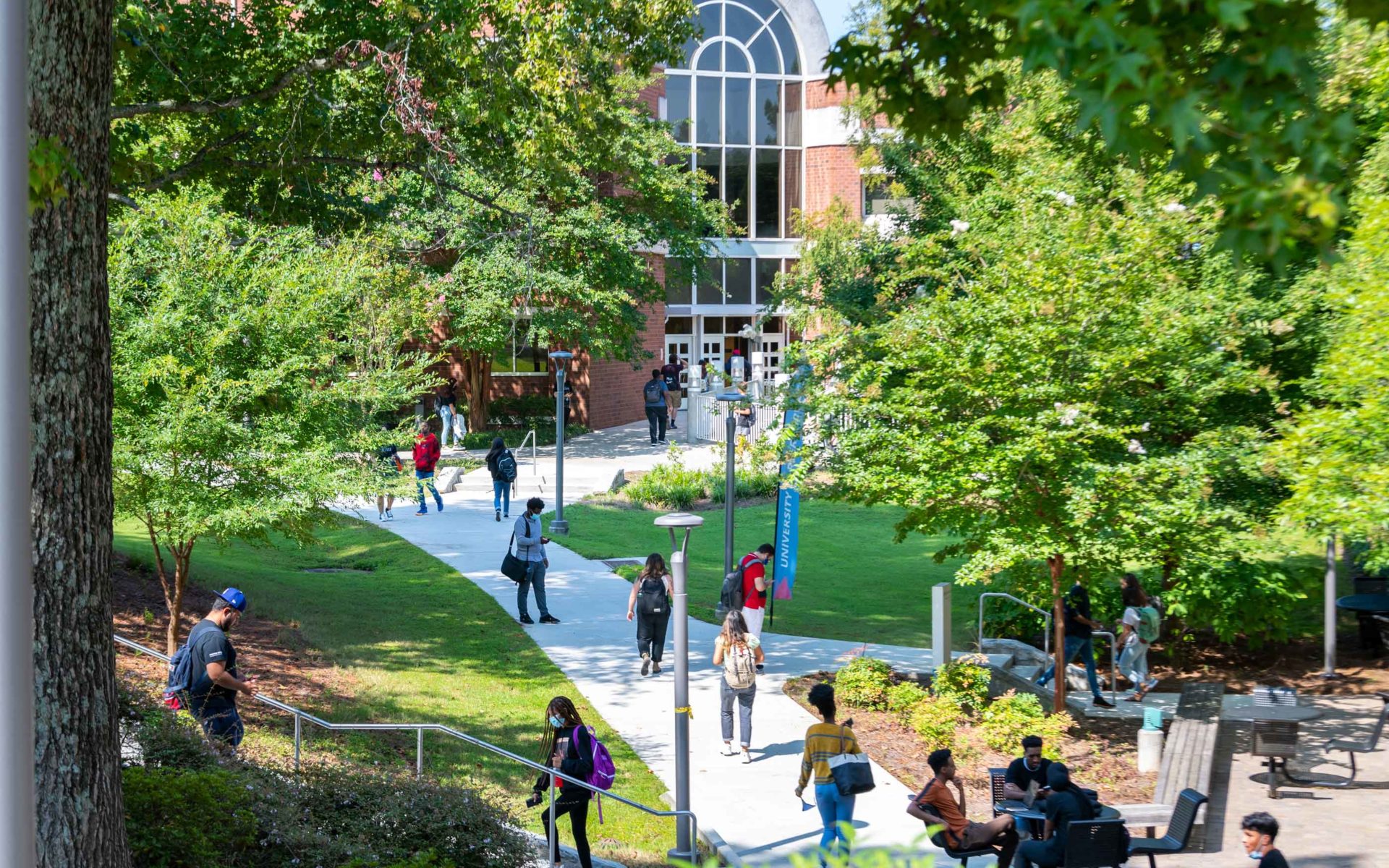 A wide shot of students walking on Dunwoody campus