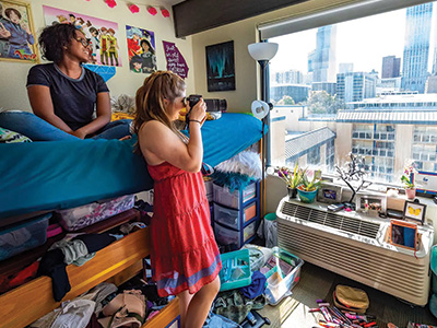 Students in their room on campus