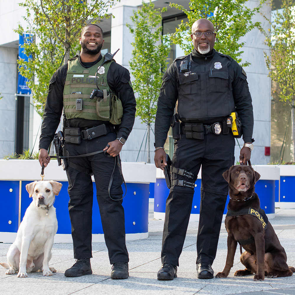 Two Georgia State police officers with their dogs