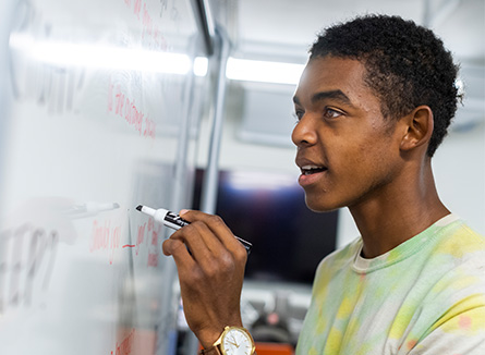 Student at the white board.